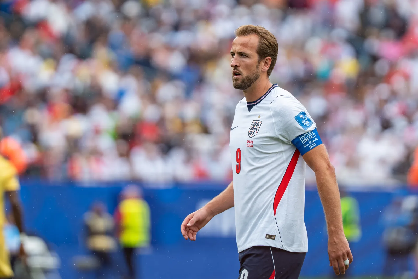 England captain Harry Kane in action, wearing the captain's armband.